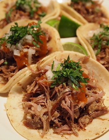 Carnitas street tacos with cilantro and lime